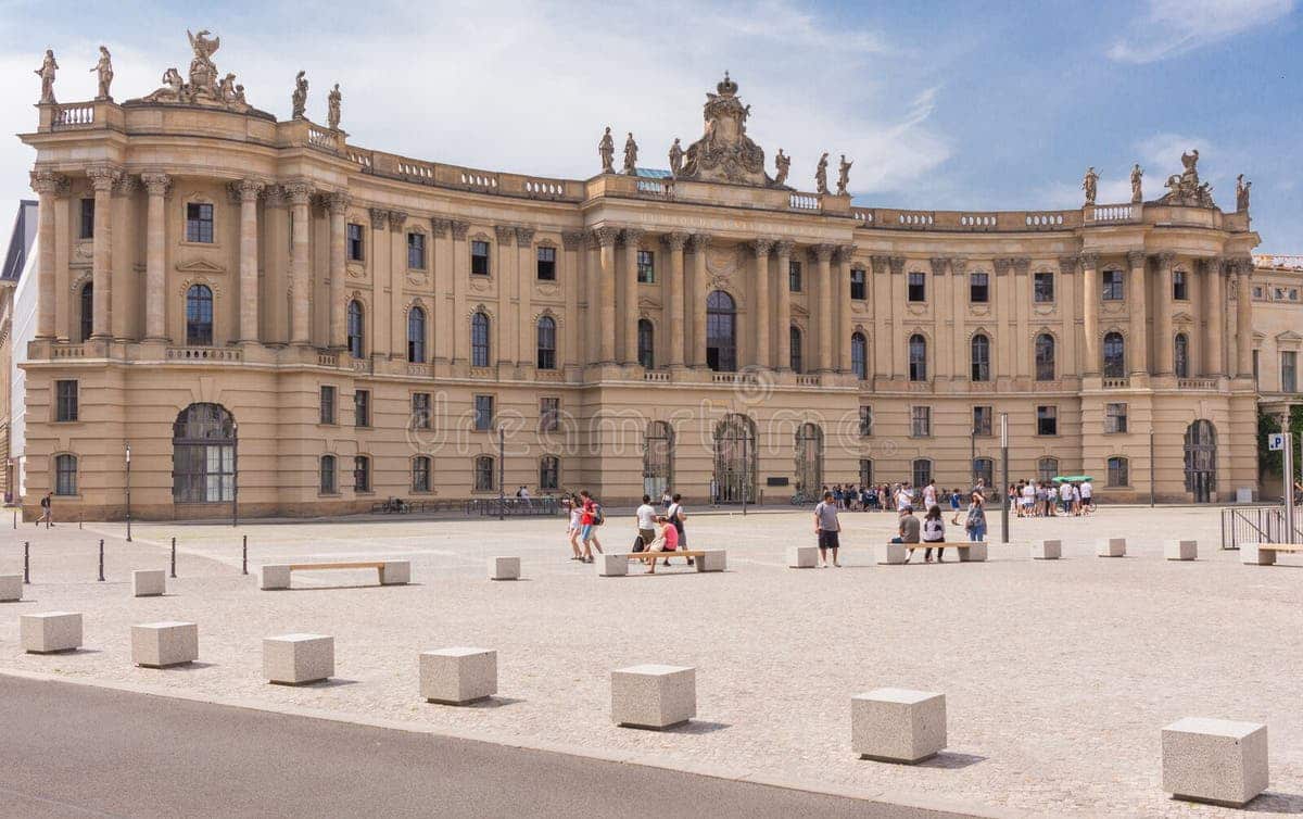 Humboldt University of Berlin – Germany’s Historic Academic Hub Historic exterior view of Humboldt University of Berlin with grand neoclassical columns and student activity in front.