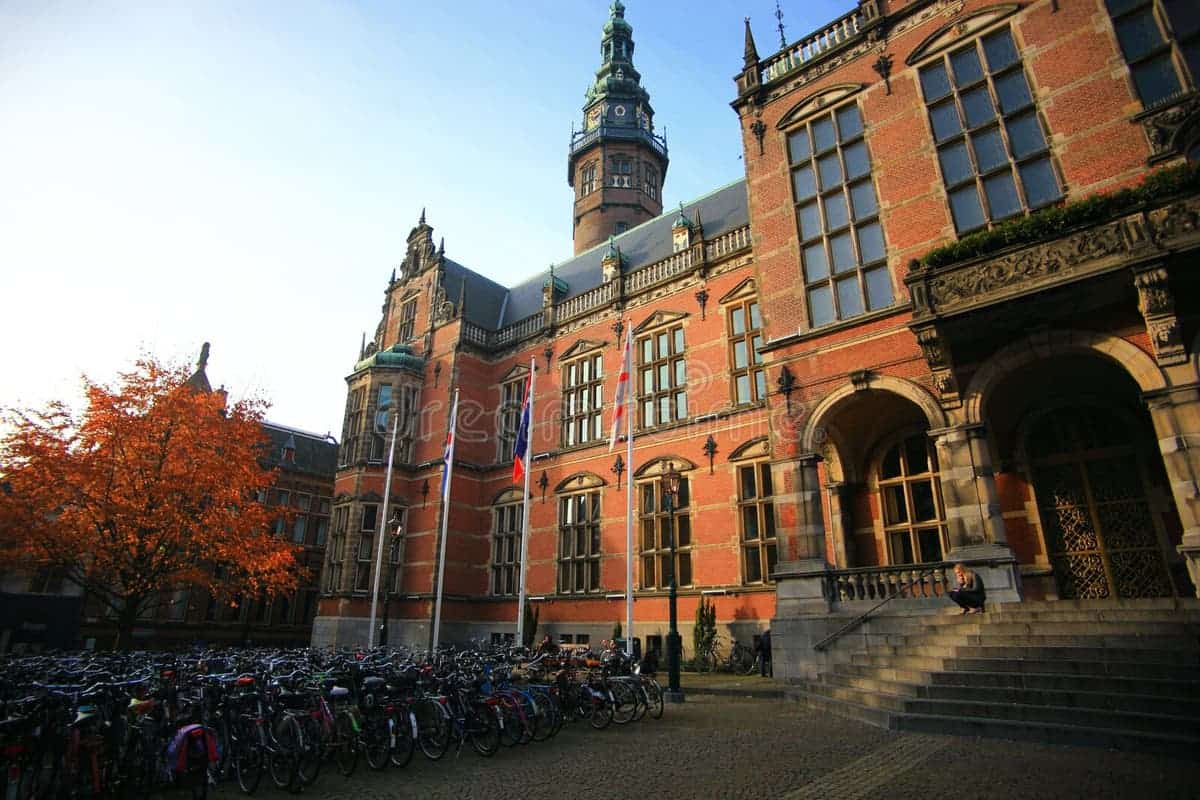 University of Groningen – Prestigious Dutch University Front view of the University of Groningen in the Netherlands with historic European-style buildings and a clear blue sky.
