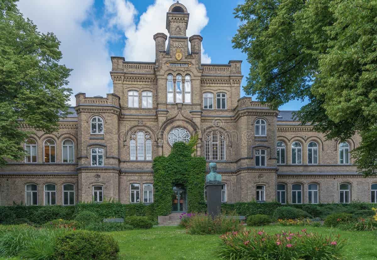 Lund University – Sweden’s Most Prestigious University Elegant view of Lund University in Sweden with classical architecture, greenery, and clear skies.