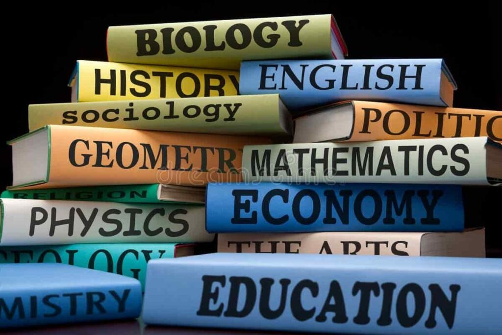 Stack of books with various academic subjects on the spine, including Biology, History, English, Mathematics, and Education.