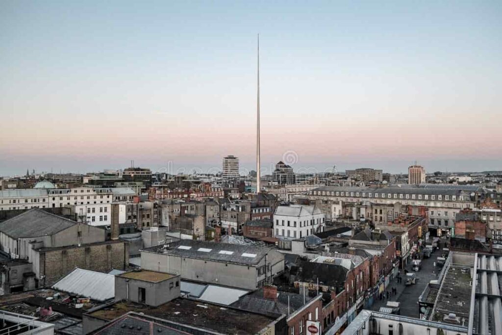 Aerial view of Dublin city in Ireland featuring the iconic Spire of Dublin during sunset
