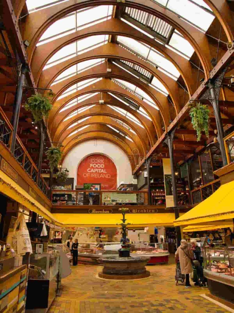 Interior view of a grand hall in Ireland with arched wooden ceiling and bookshelves โ symbolizing culture and lifestyle for Cost of Living in Ireland.