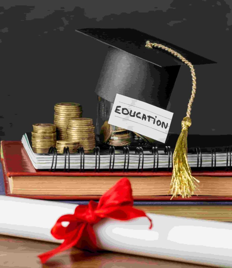 Graduation cap, books, and stacked coins symbolizing education funding and financial planning.