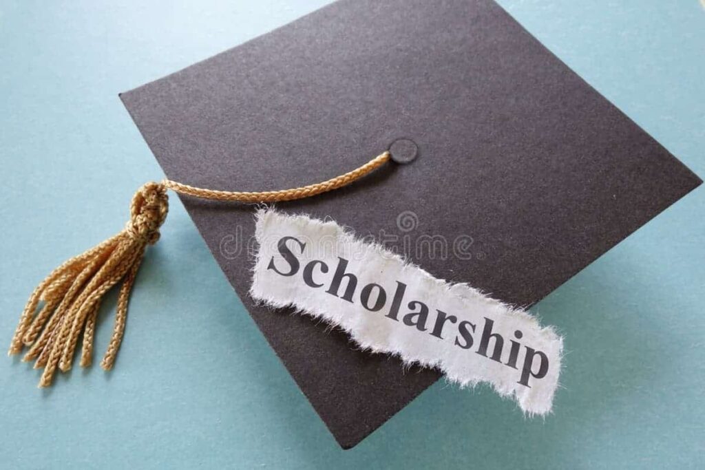 Graduation cap with a tassel and a card labeled โScholarshipโ โ representing scholarships and financial aid in Ireland.