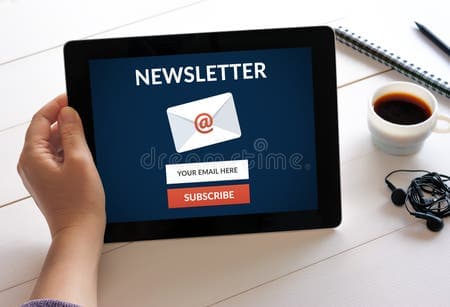 Tablet screen showing a newsletter subscription form with email input and subscribe button