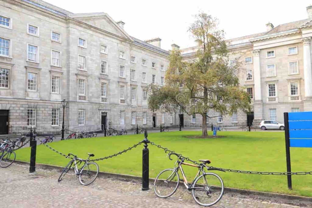 Historic university campus in Ireland with stone buildings, green lawns, and clear blue sky โ representing top universities in Ireland.