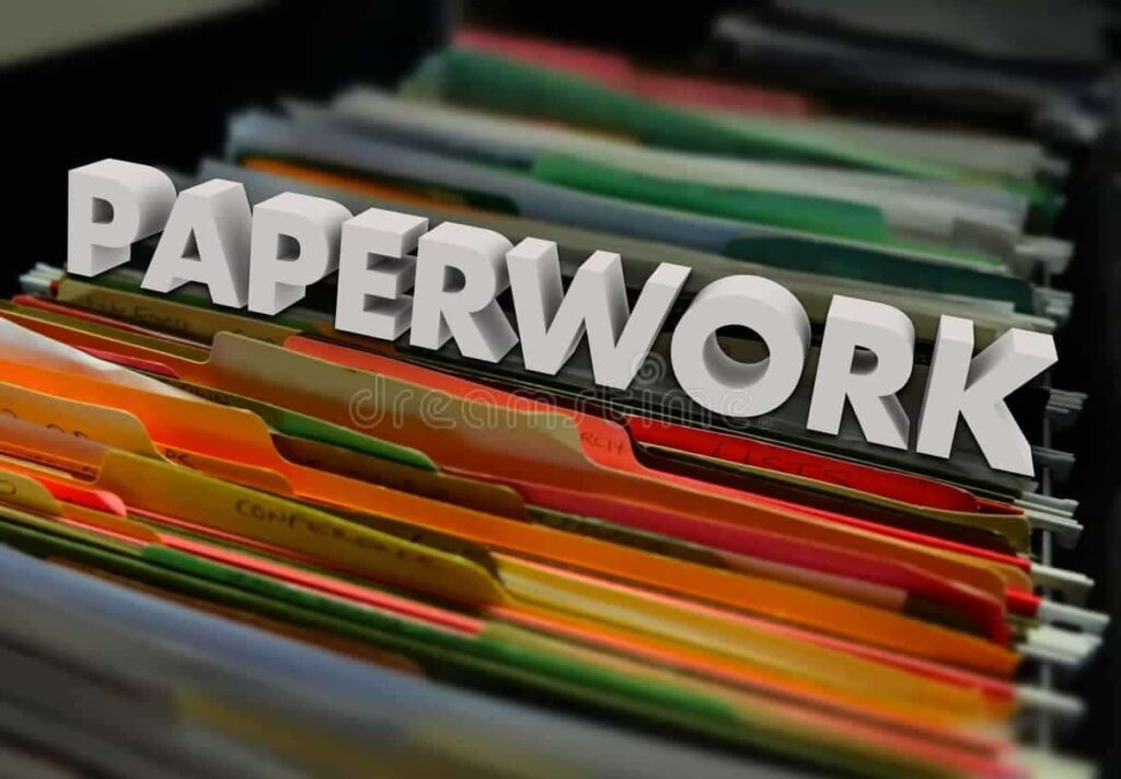 Word "PAPERWORK" displayed over rows of colorful document folders in a filing cabinet