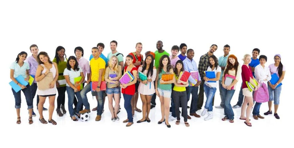 Group of diverse international students standing together holding books and notebooks