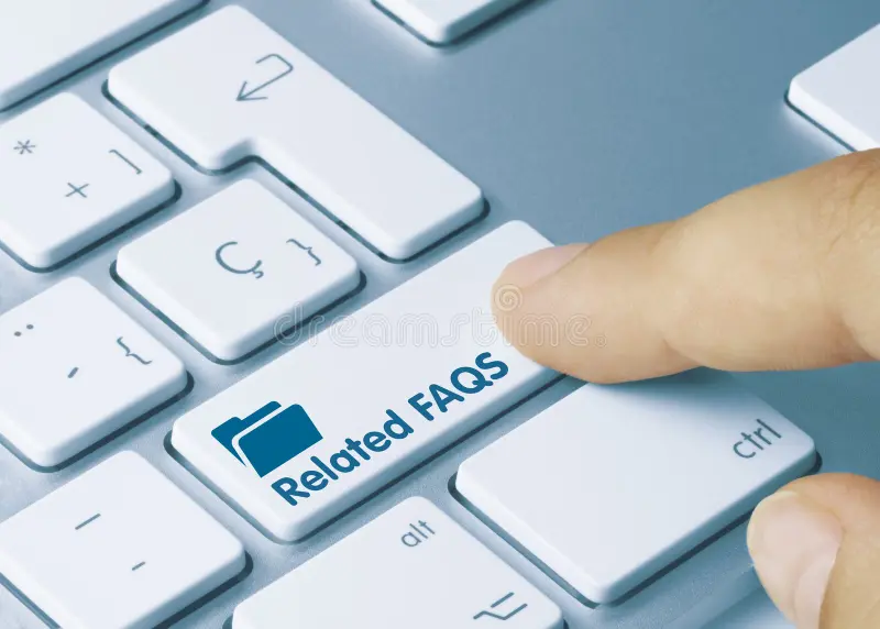Finger pressing a keyboard key labeled “Related FAQs” — quick answers for Study in Singapore.