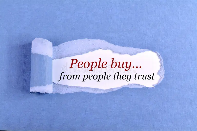 Text message saying People buy from people they trust on torn paper background – StudySilently
