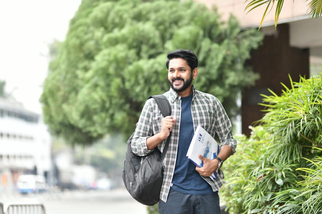 Indian student with backpack holding admission documents on campus — Admissions & Eligibility, Study in India.