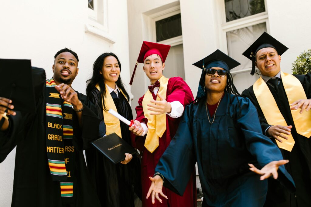 Graduates celebrating together in their caps and gowns, symbolizing success and key takeaways after studying in India.