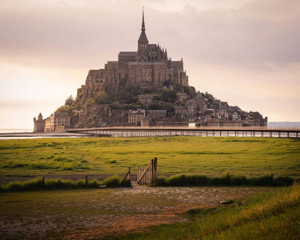 Mont-Saint-Michel in France during sunset, symbolizing top academic and cultural study destinations