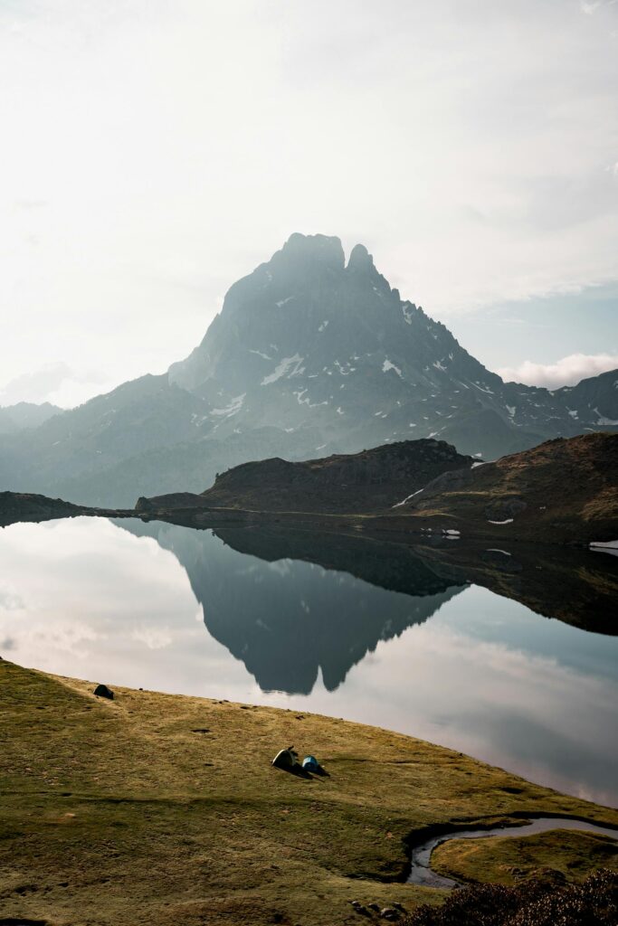 Scenic view of Pic du Midi d’Ossau and Lake Gentau in the French Pyrenees, representing the beauty and opportunities of studying in France.
