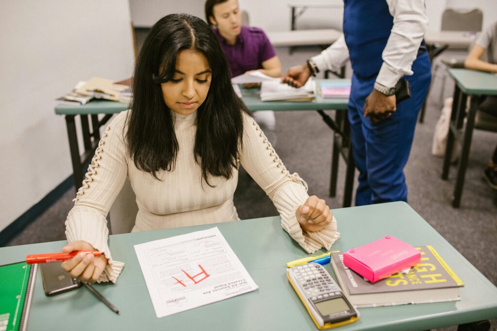 Student reviewing an exam paper with a low grade, representing the French grading system and ECTS evaluation process