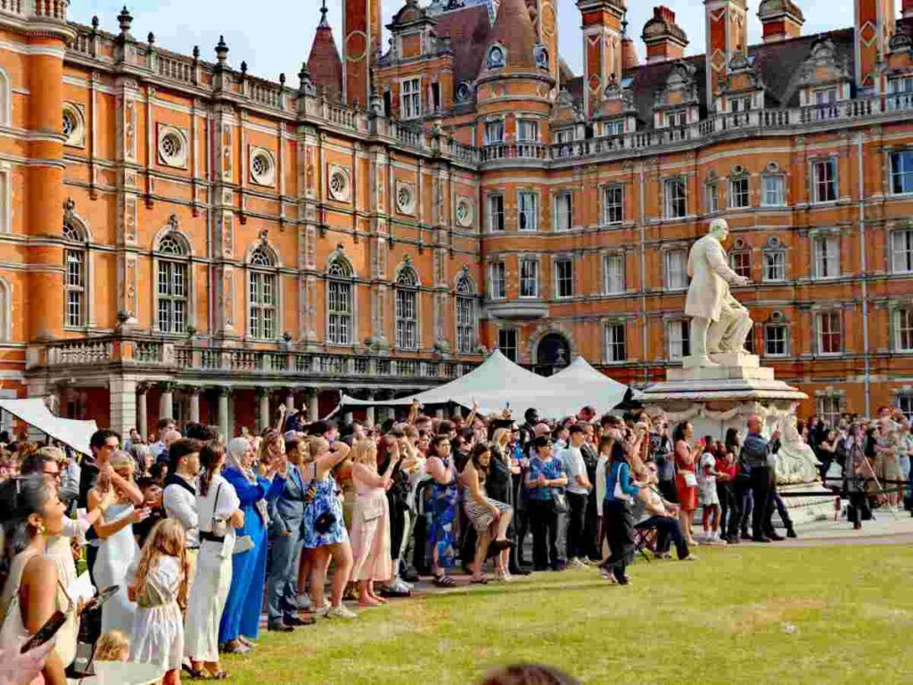 Students gathered on a university campus in Egham, England, representing the first steps of starting a study abroad journey in the UK.