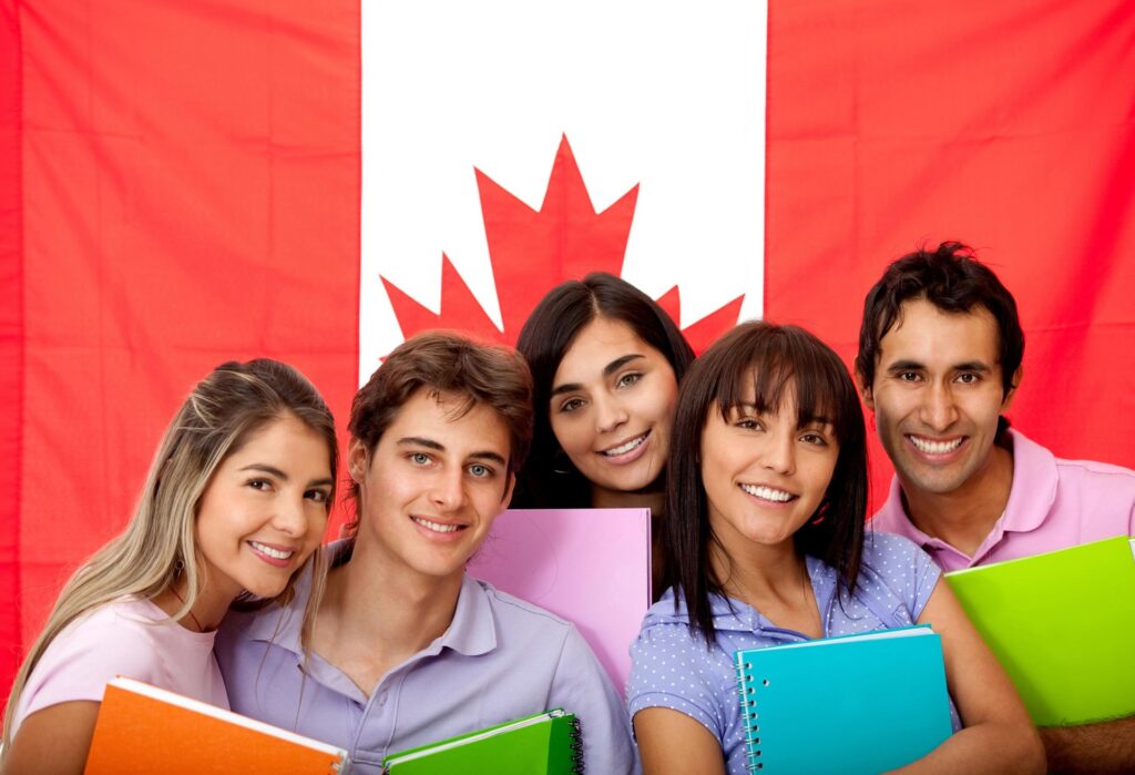 International students holding documents in front of Canada flag for student visa application