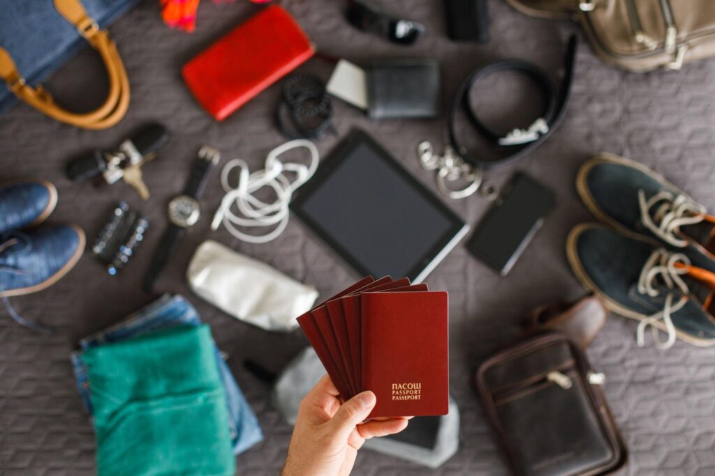 Study Abroad Packing List essentials with passport, gadgets, clothes and travel items before international travel