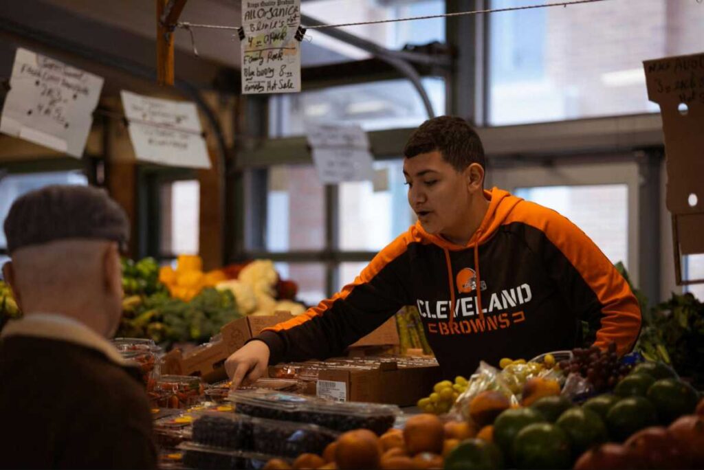 student life abroad cost of living student buying groceries from market daily expenses budget guide