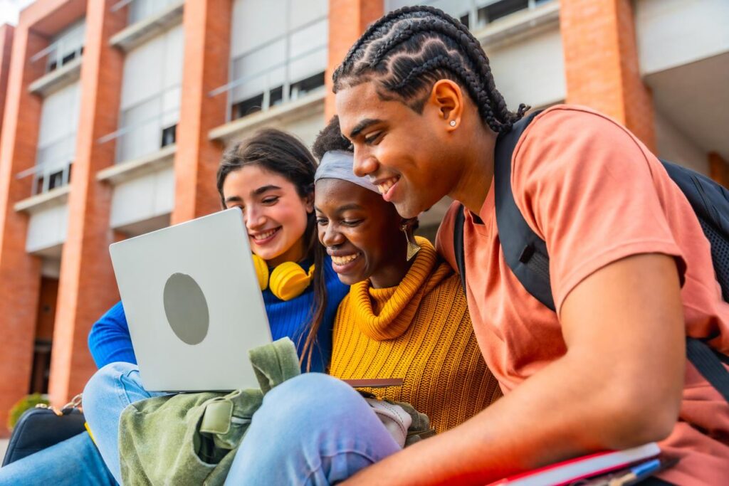 Affordable Study Abroad Countries students choosing study destination on laptop