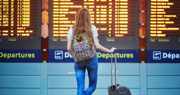 International student at airport departures terminal facing uncertainty after student visa expiry