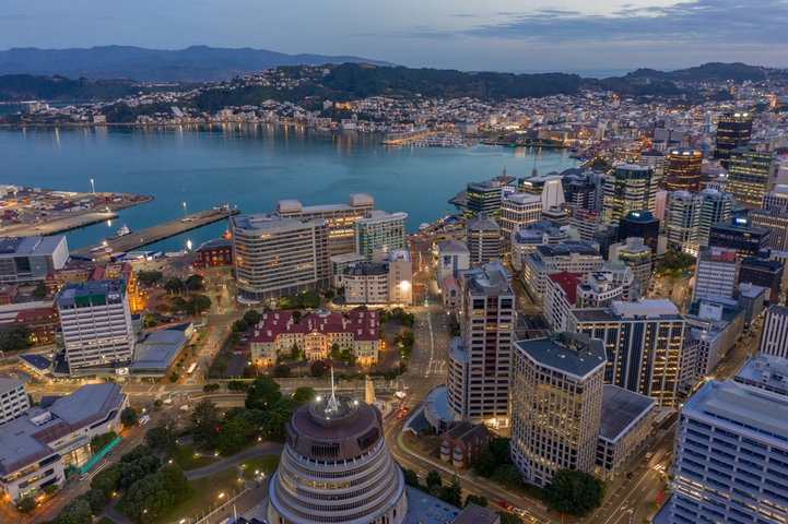 Study in New Zealand featuring the Wellington city skyline, modern buildings, and waterfront representing world-class education opportunities for international students.