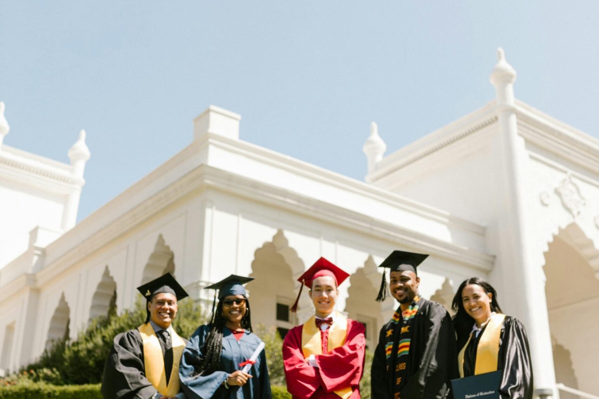 Group of international students celebrating graduation in the USA, symbolizing success and higher education abroad